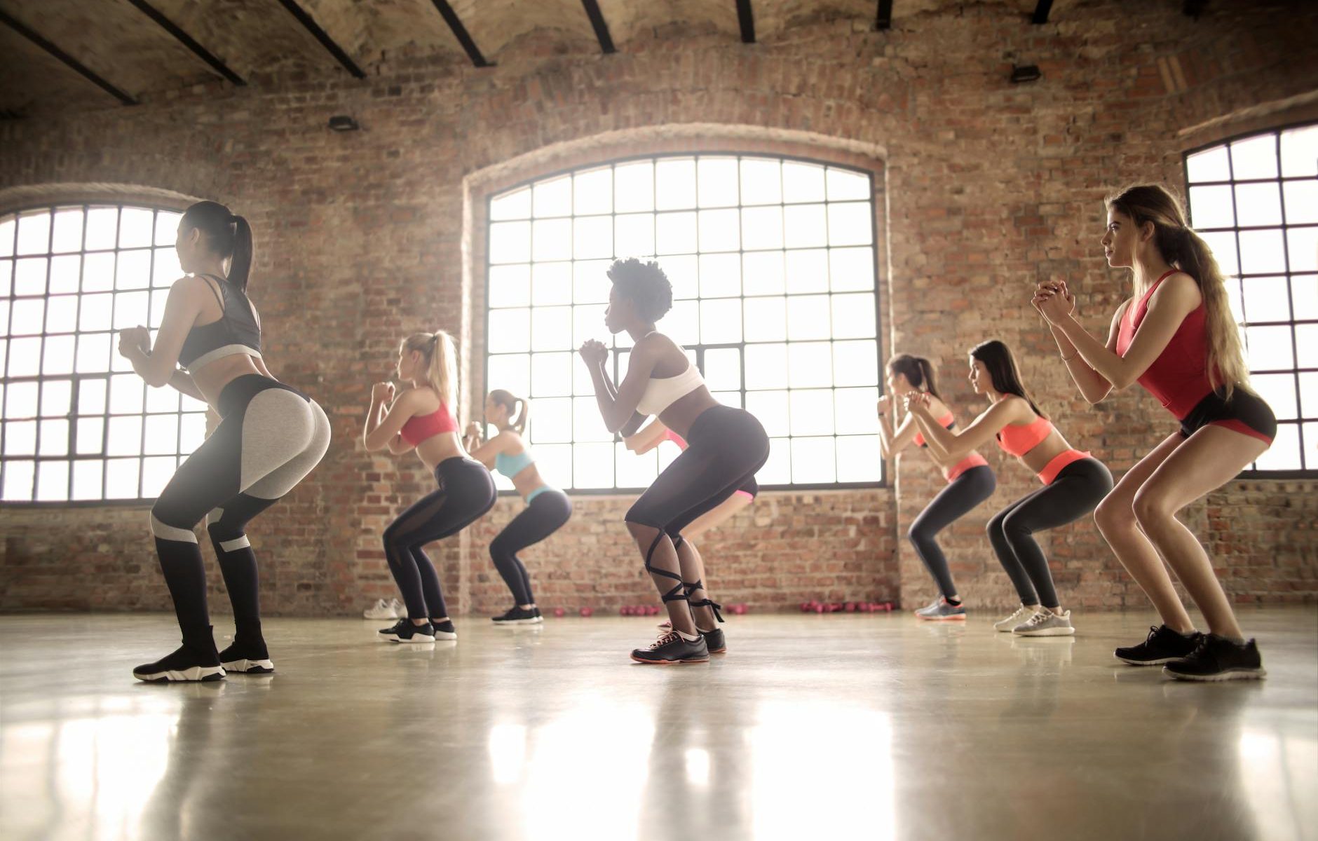 group of women doing exercise inside the building